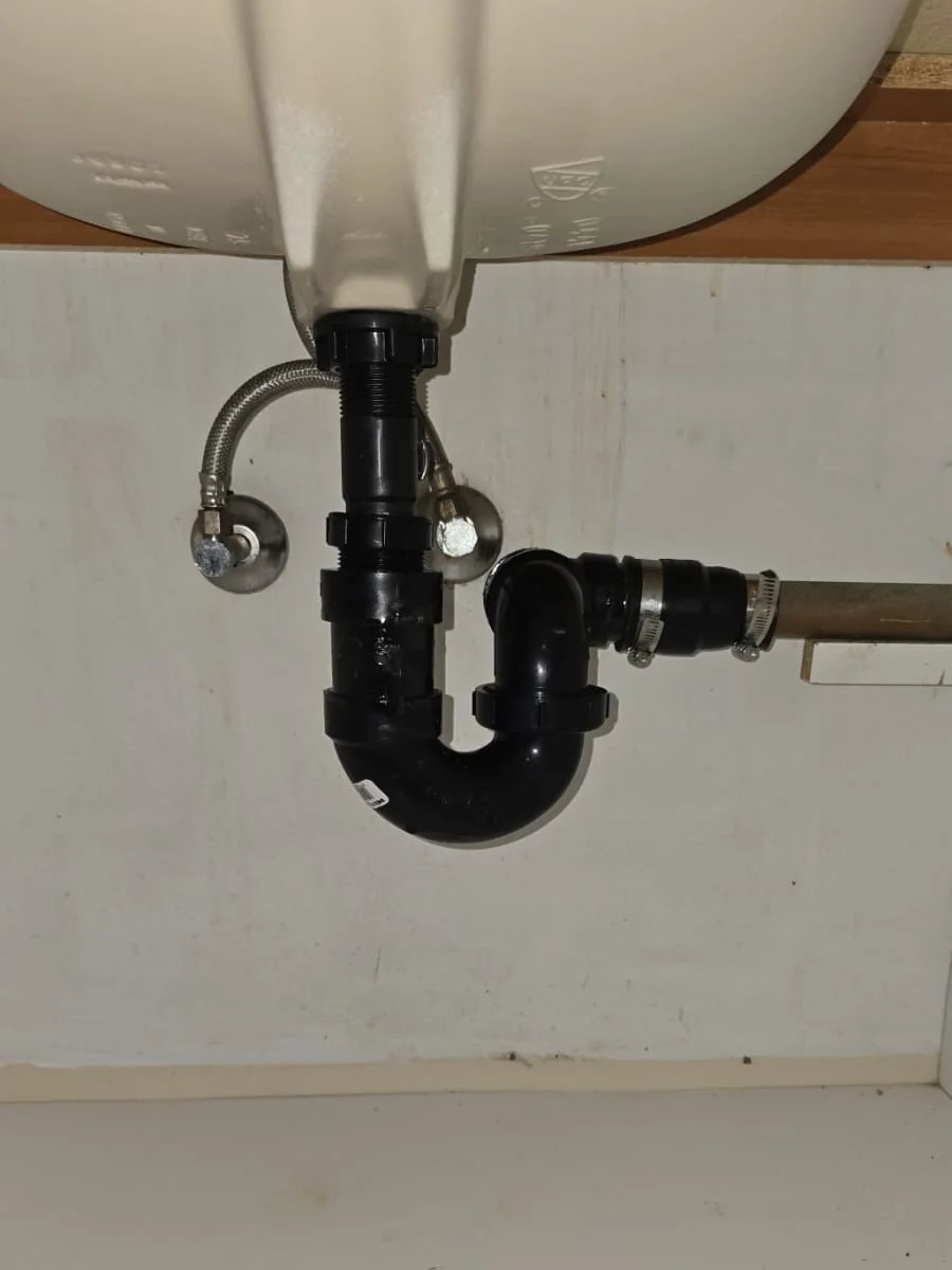 Drain, P-trap and shut-off connections beneath a bathroom sink